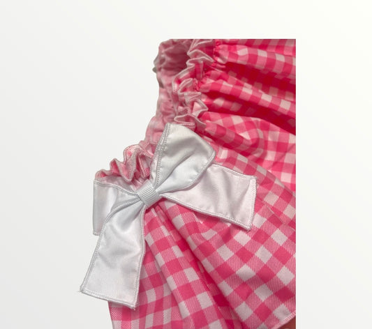 Comprar conjunto de algodón con falda cubrepañal para niñas. Moñas en color blanco. Estampado vichy. Color rosa fucsia. Temporada primavera-verano.