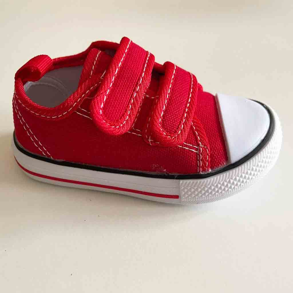 Vista lateral de zapatillas de lona con velcro para bebé niño o niña. Marca Bubble Bobble. Color rojo.