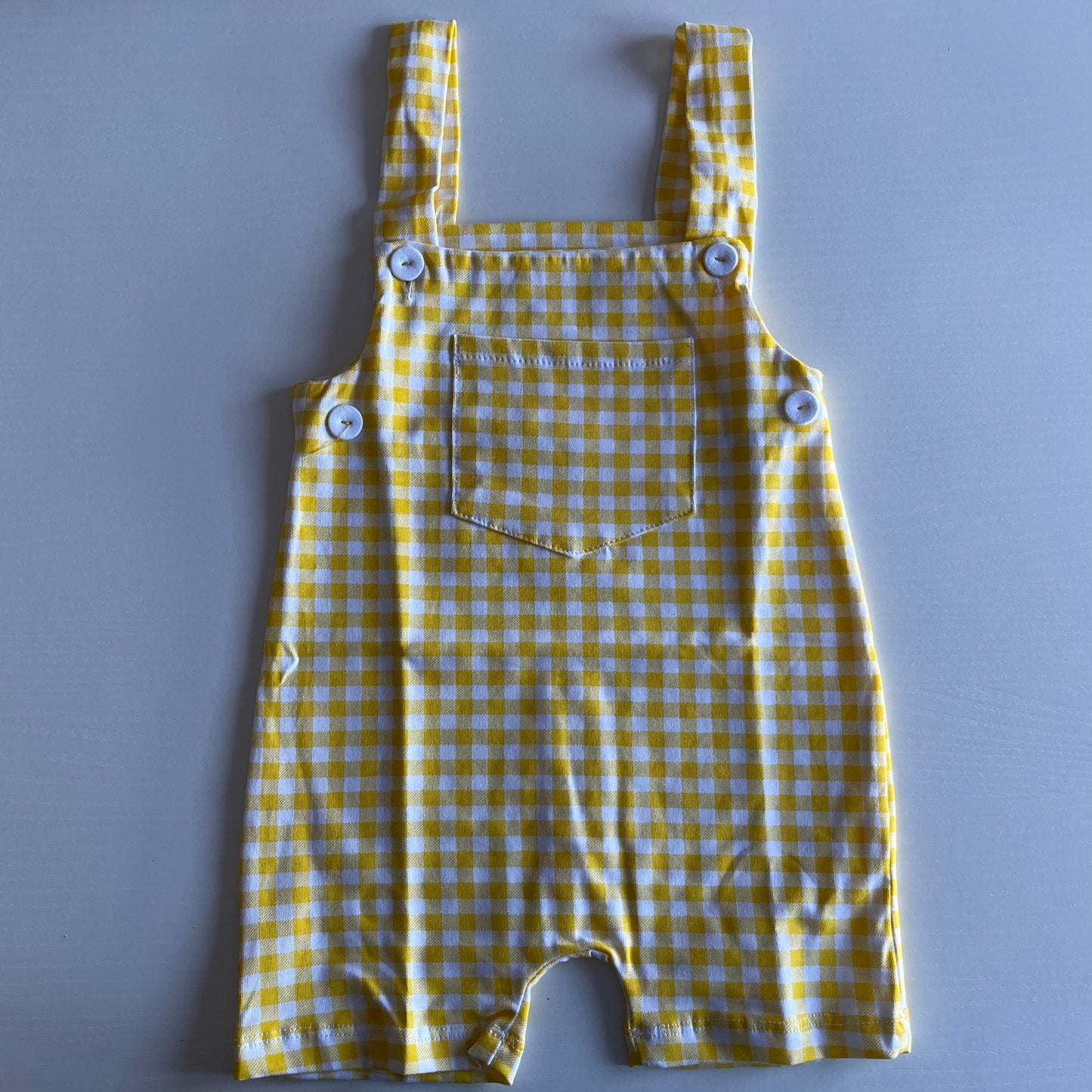 Comprar peto vichy unisex para bebés. Color amarillo. Marca Petit Cie. Ideal temporada Primavera-Verano.