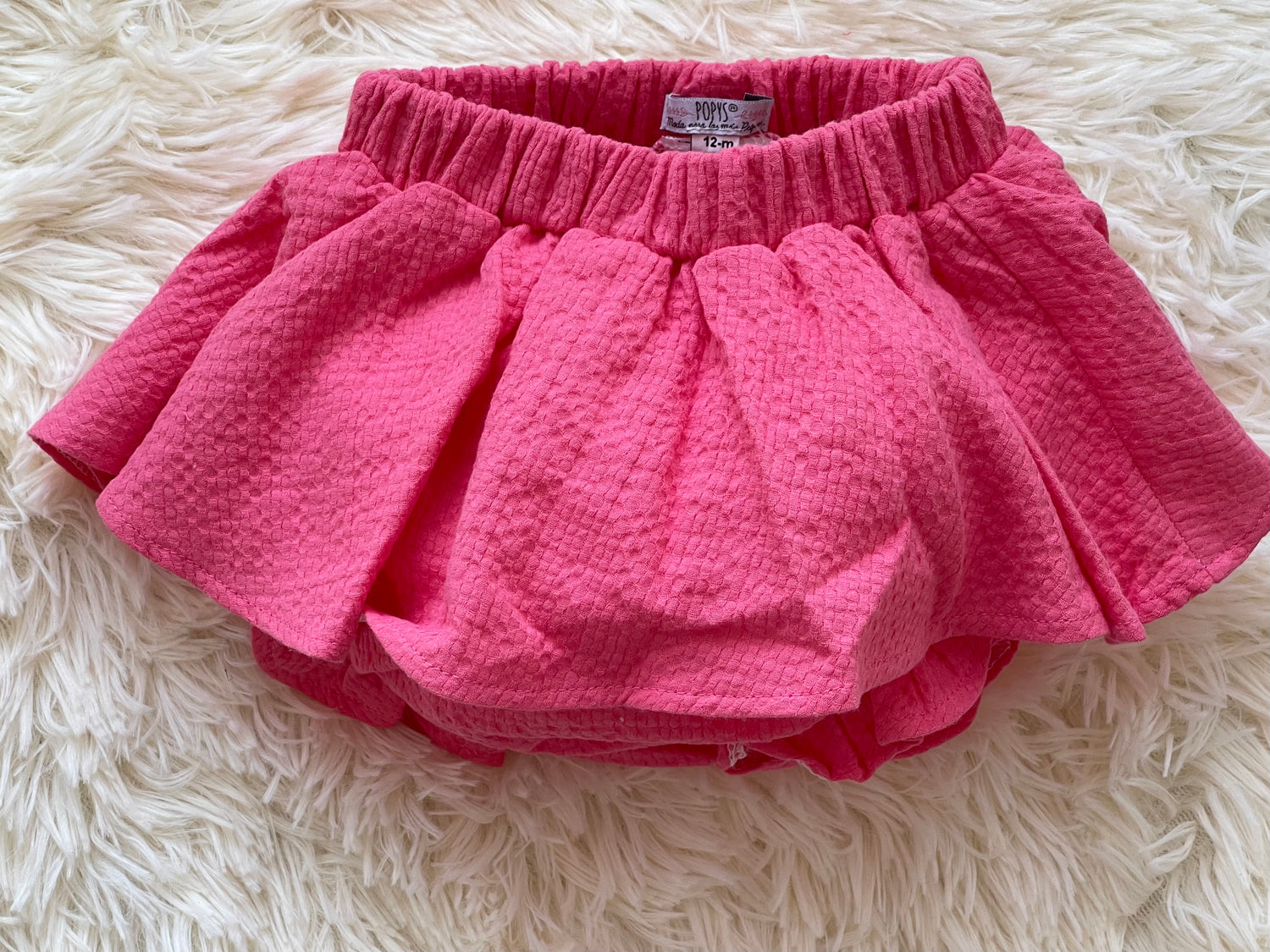 Comprar faldas cubrepañal para bebé niña. Color rosa fuccsia. Marca Confecciones Popys.