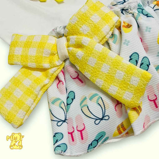 Comprar  conjunto para bebé niña con falda cubrepañal. Color amarillo. Detalle de moña vichy. Temporada primavera-verano.